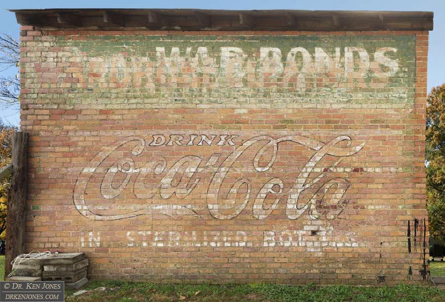 Coca Cola / War Bonds and Stamps / Barber Shop / Wardrobe Cleaners, Bald Knob, Arkansas